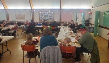 Many people eating dinner