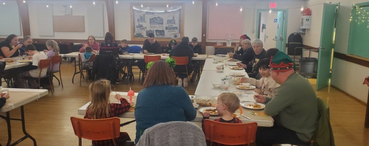 Many people eating dinner